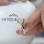 Hidden halo diamond detail beneath round center stone