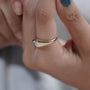 Front view of east west pear cut diamond ring