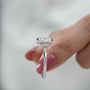 Cushion cut lab diamond ring with elegant hidden halo and classic four-prong solitaire design.