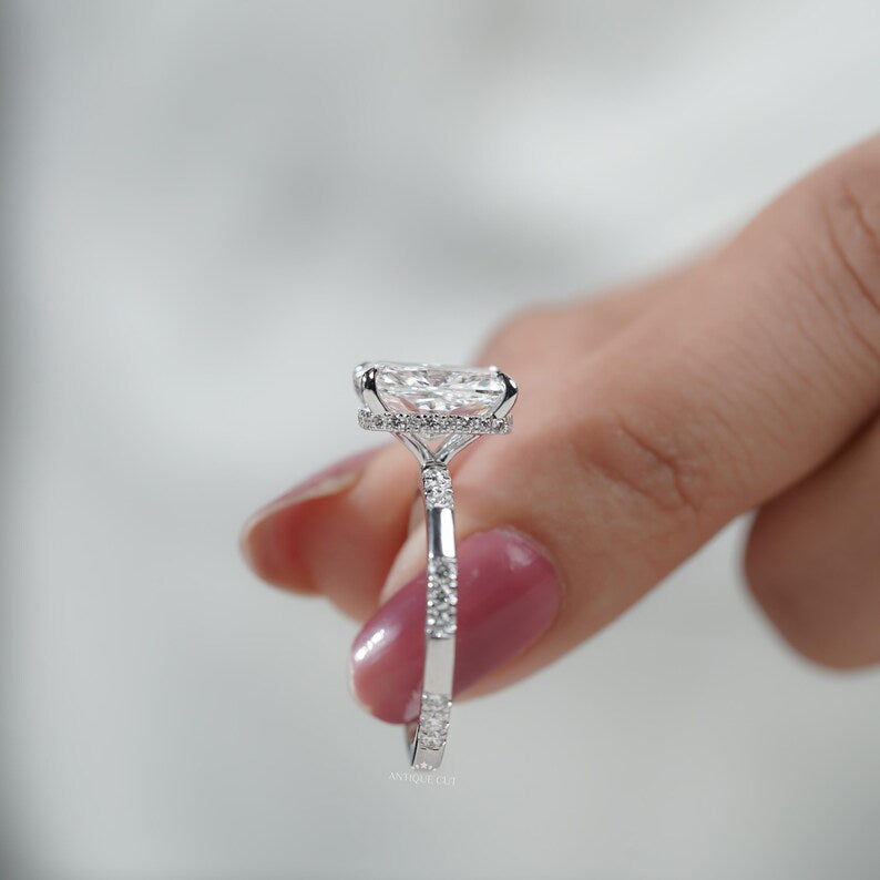 Cushion cut lab diamond ring with elegant hidden halo and classic four-prong solitaire design.
