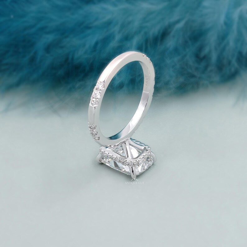 Handmade cushion cut lab diamond engagement ring with hidden halo and minimalist band.