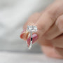 Ethical lab grown cushion cut diamond engagement ring with sleek white gold band.