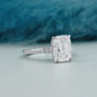 Elegant cushion cut diamond engagement ring featuring a hidden halo and polished white gold band.