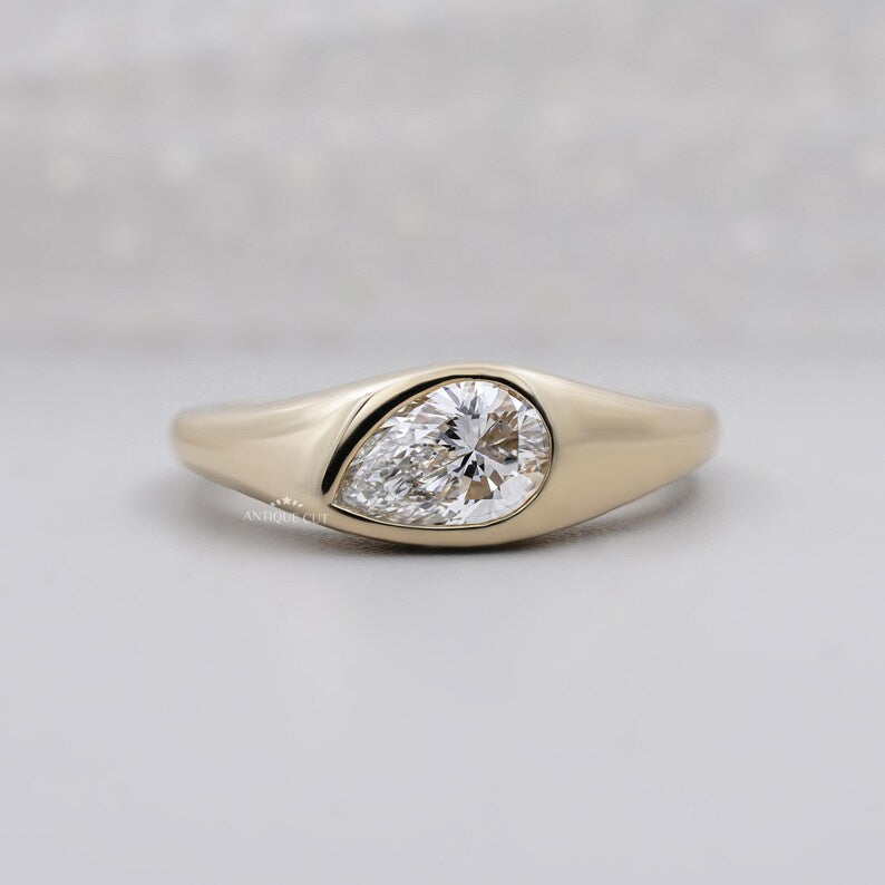 Pear cut lab grown diamond signet ring in yellow gold