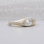 East west pear diamond ring with smooth bezel setting