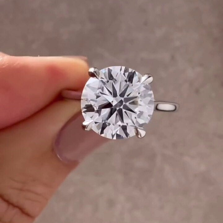 Round Cut Diamond Ring with cathedral setting and hidden halo