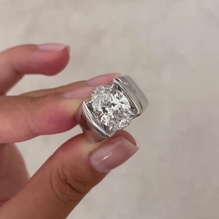 Men's engagement ring with oval diamond and channel band