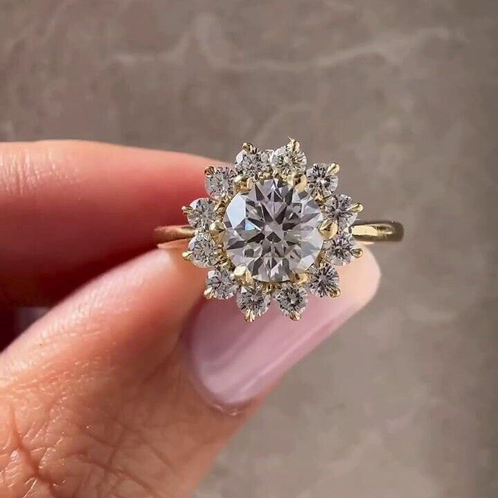 Round Cut Diamond Cathedral Engagement Ring with halo design