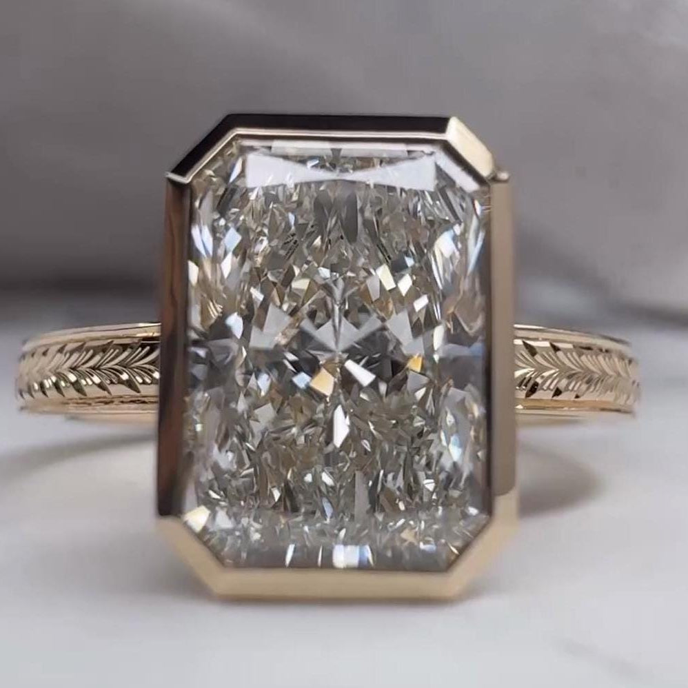 Bezel radiant engagement ring yellow gold lab grown diamond