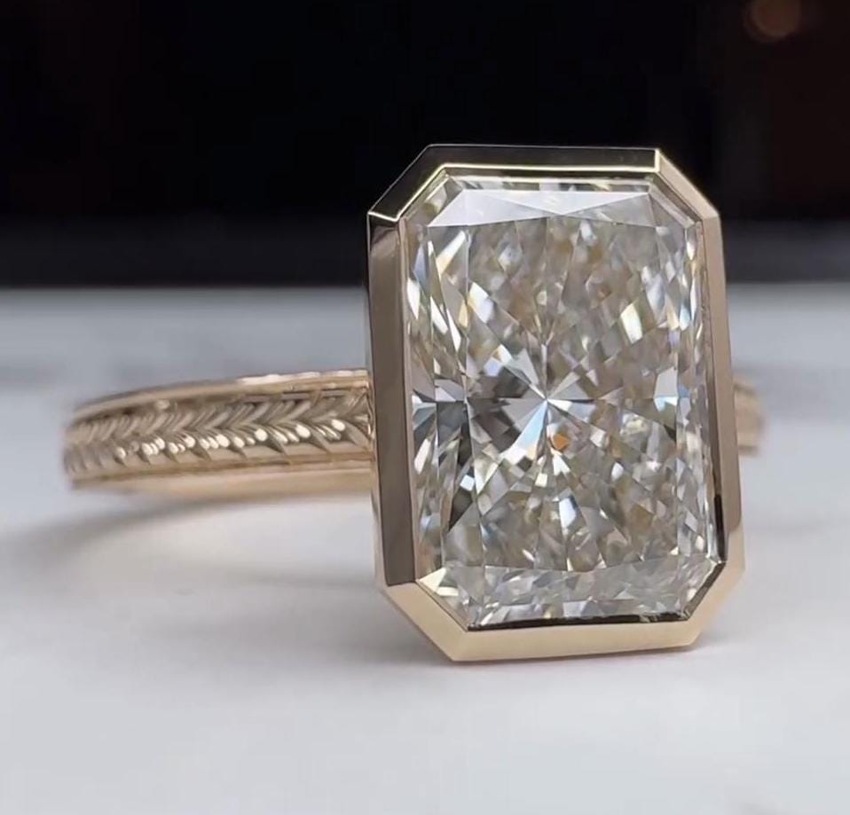 Hidden stone radiant engagement ring bezel setting