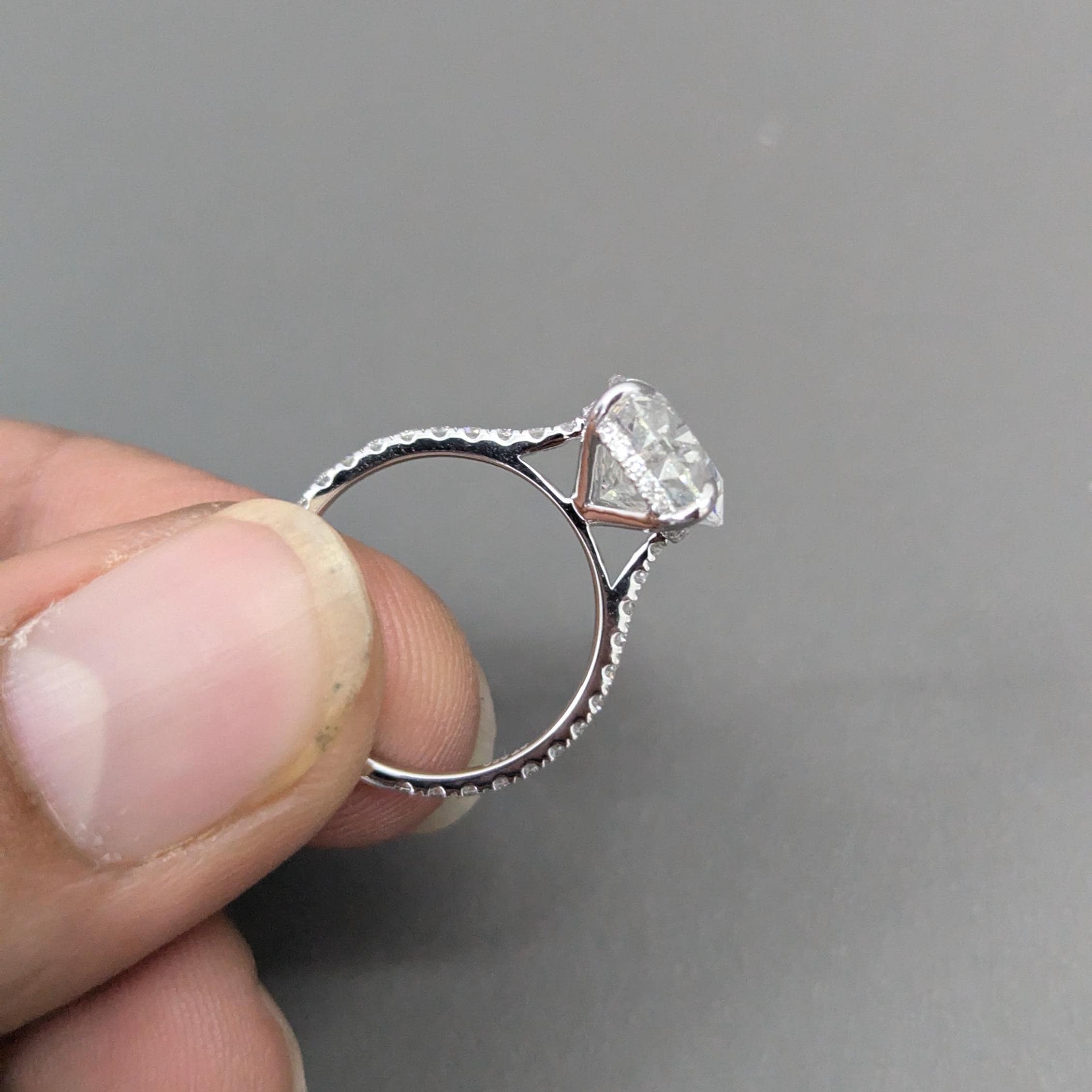 Oval 5.30tcw lab-grown diamond engagement ring with Hidden Halo Cathedral Setting, D-E-F, VVS-VS clarity