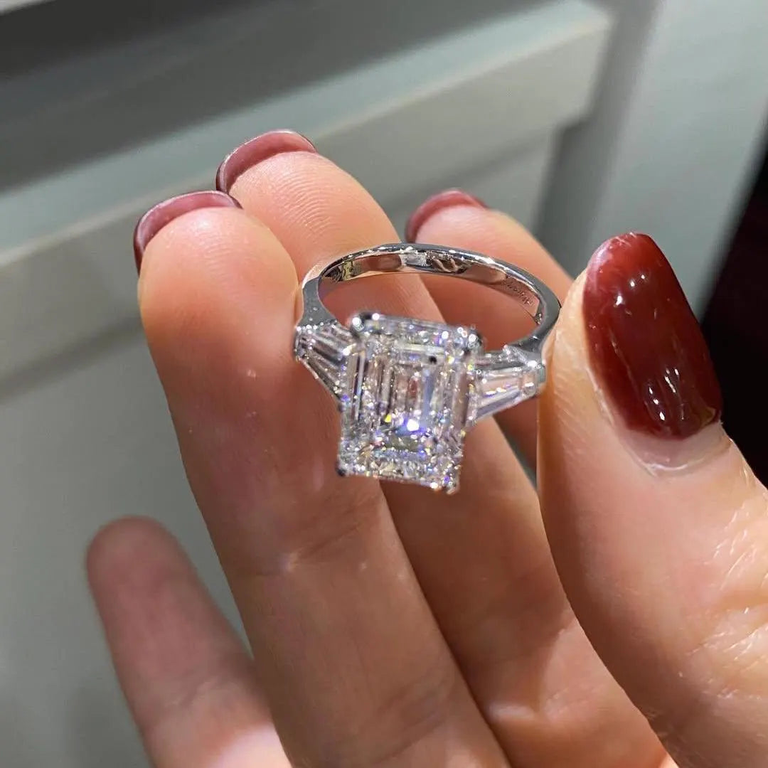 Emerald 5.50tcw Lab Grown Diamond Three Stone Cathedral Engagement Ring, D-E-F Color, VVS-VS Clarity