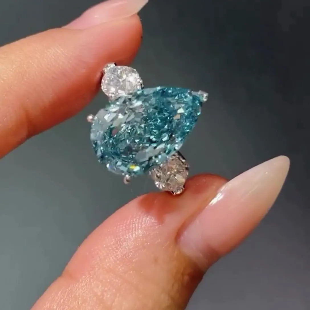 Fancy Blue Pear 7.00tcw Lab Diamond Ring | Three Stone  | 6ct Center + 1ct Side Stones