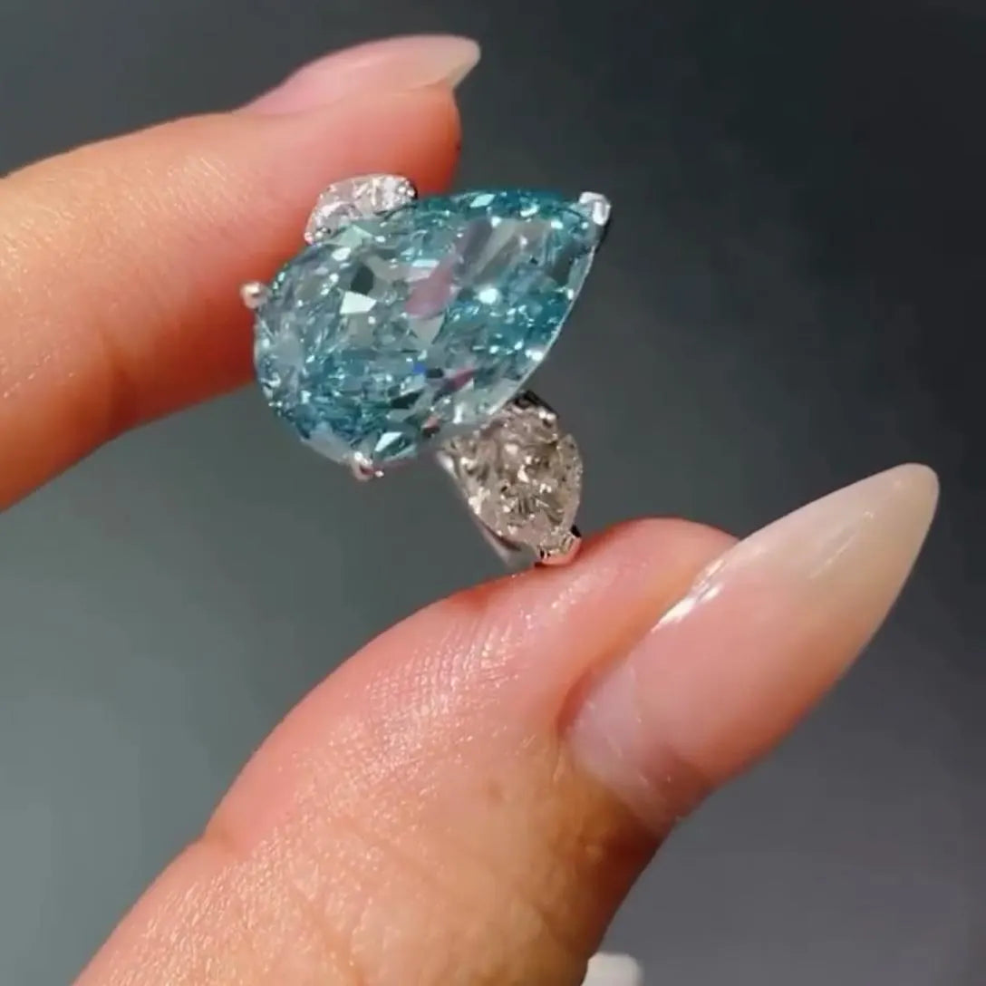 Fancy Blue Pear 7.00tcw Lab Diamond Ring | Three Stone  | 6ct Center + 1ct Side Stones