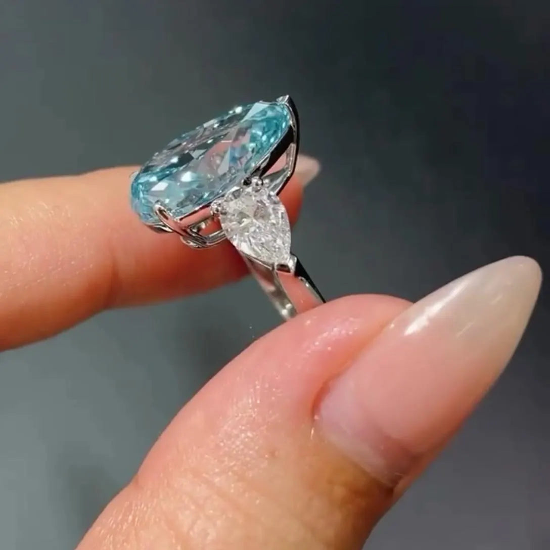 Fancy Blue Pear 7.00tcw Lab Diamond Ring | Three Stone  | 6ct Center + 1ct Side Stones