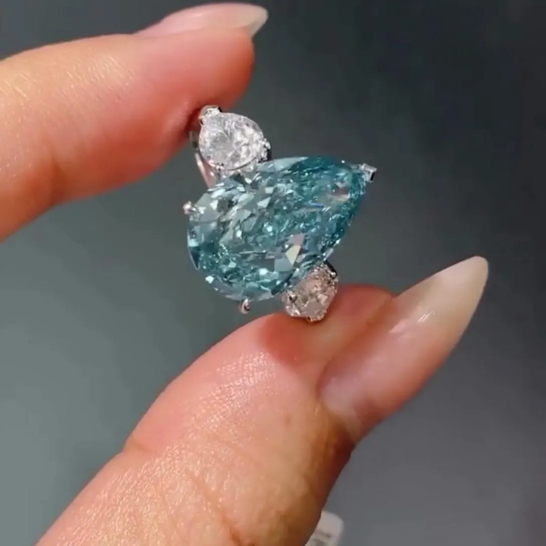 Fancy Blue Pear 7.00tcw Lab Diamond Ring | Three Stone  | 6ct Center + 1ct Side Stones