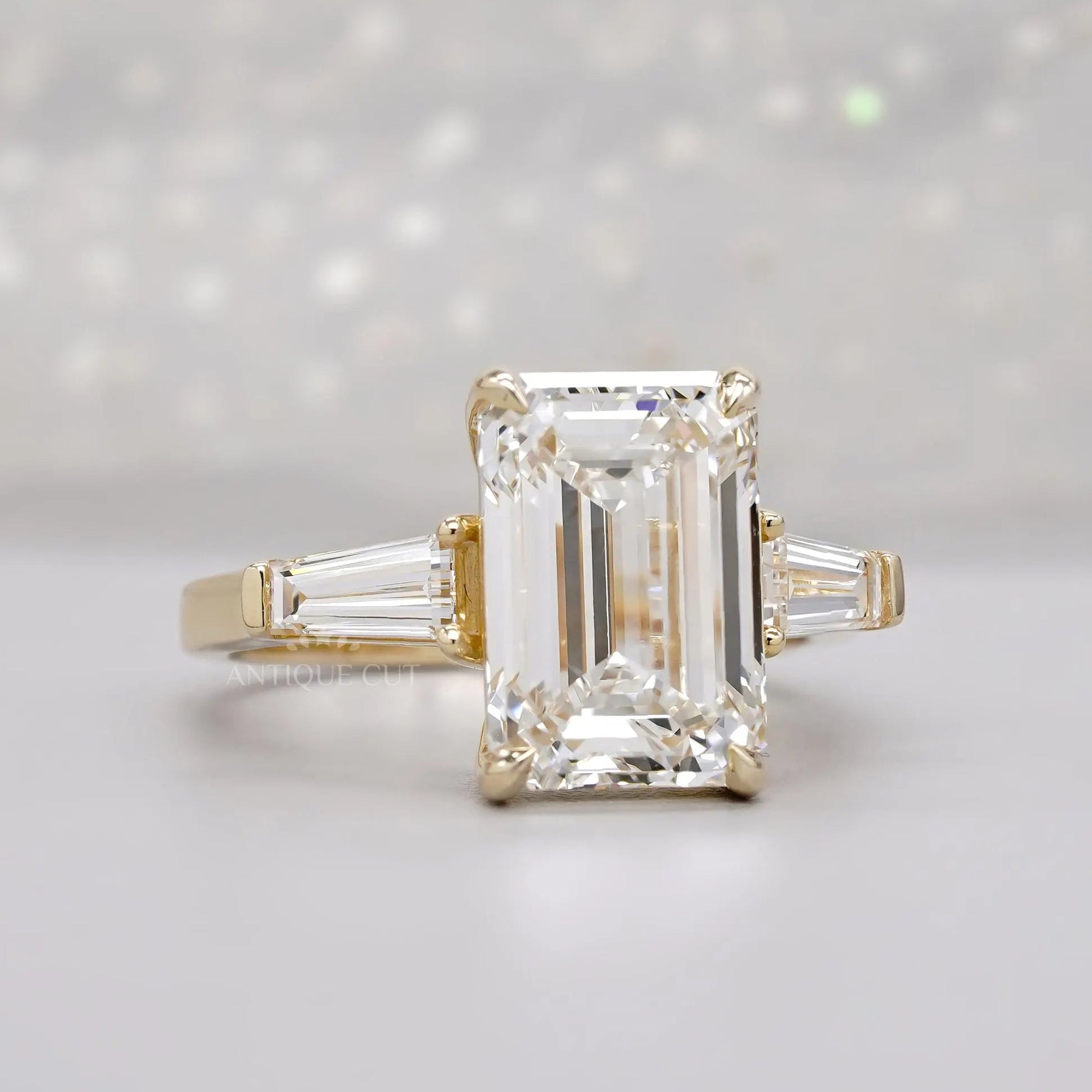 Emerald cut lab grown diamond ring with tapered baguettes