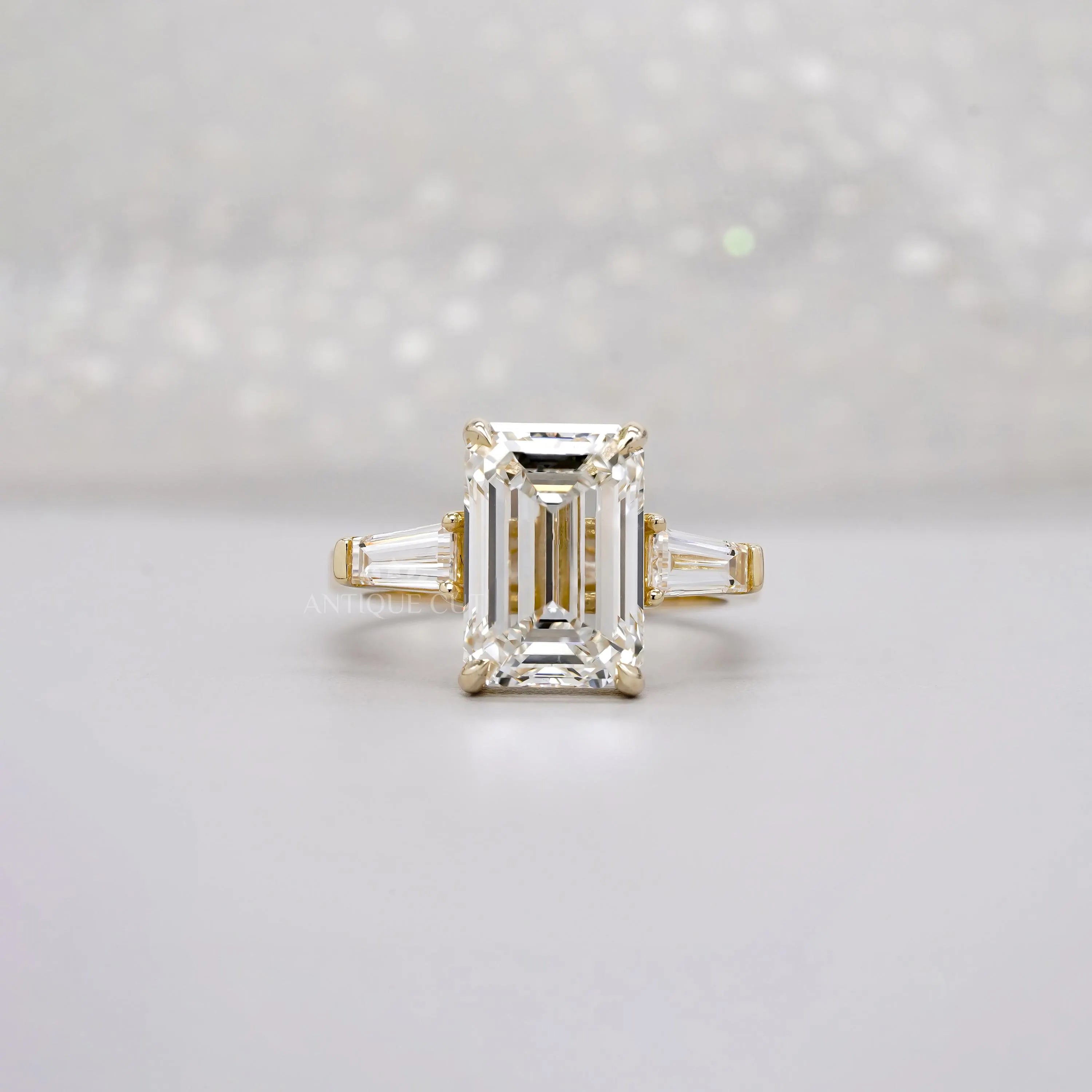 Emerald 5.60tcw Lab Diamond Three Stone Engagement Ring | Tap Baguette Side | IGI Certified