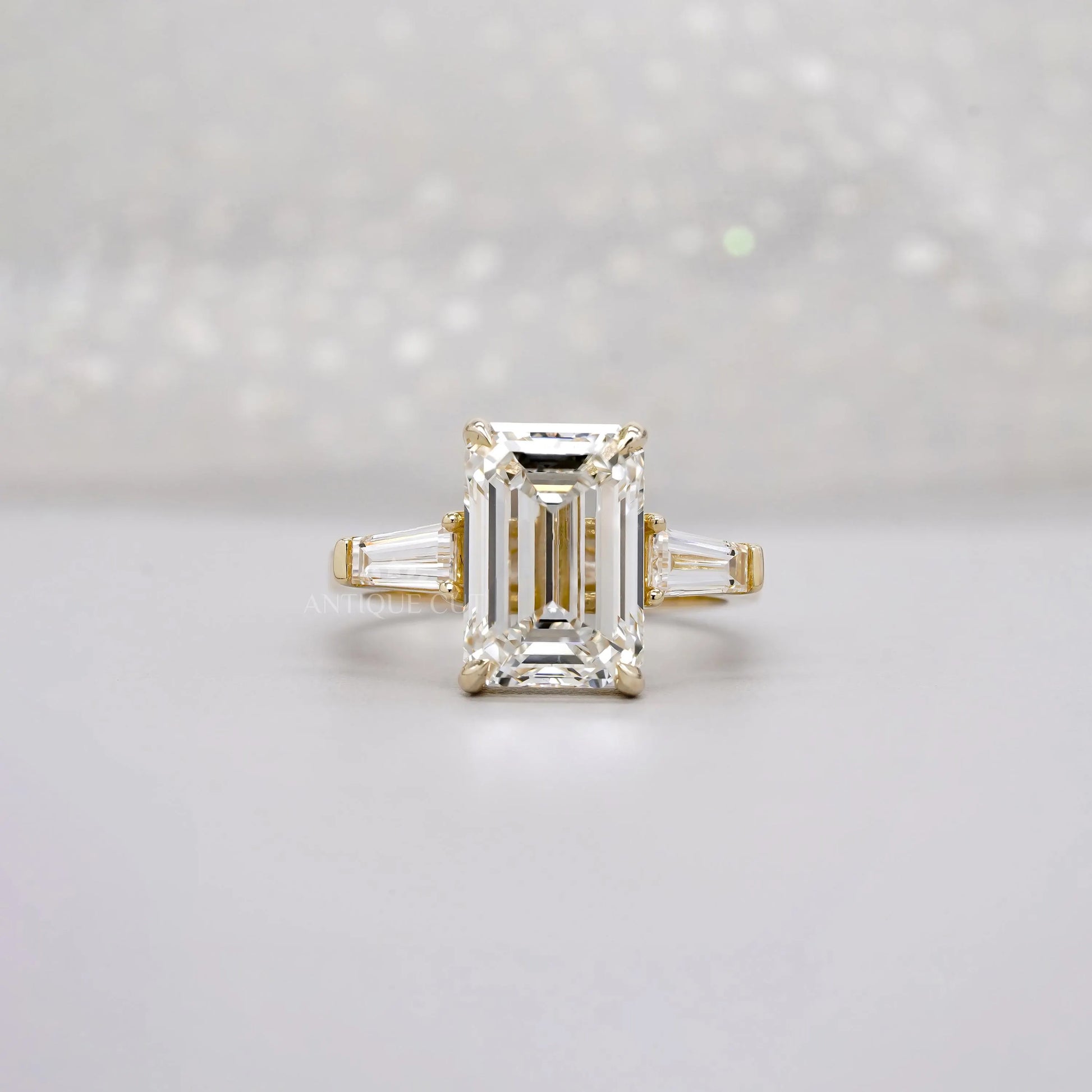 Emerald 5.60tcw Lab Diamond Three Stone Engagement Ring | Tap Baguette Side | IGI Certified