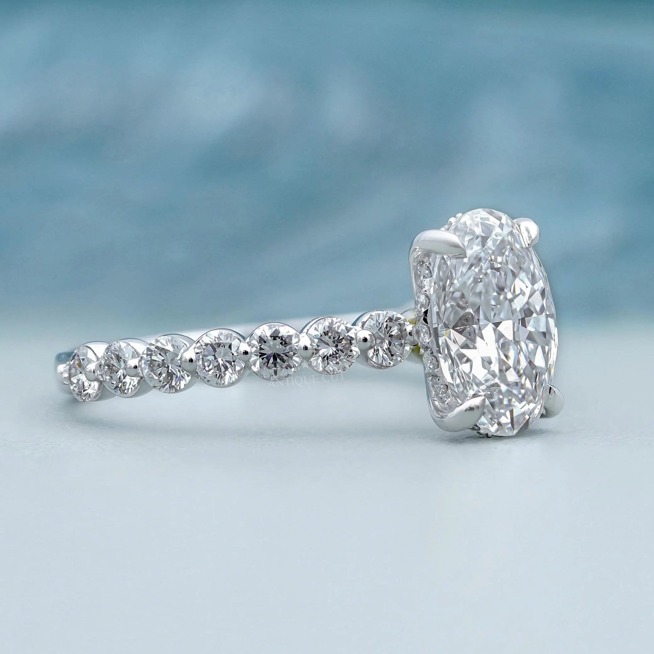 White gold oval hidden halo diamond ring