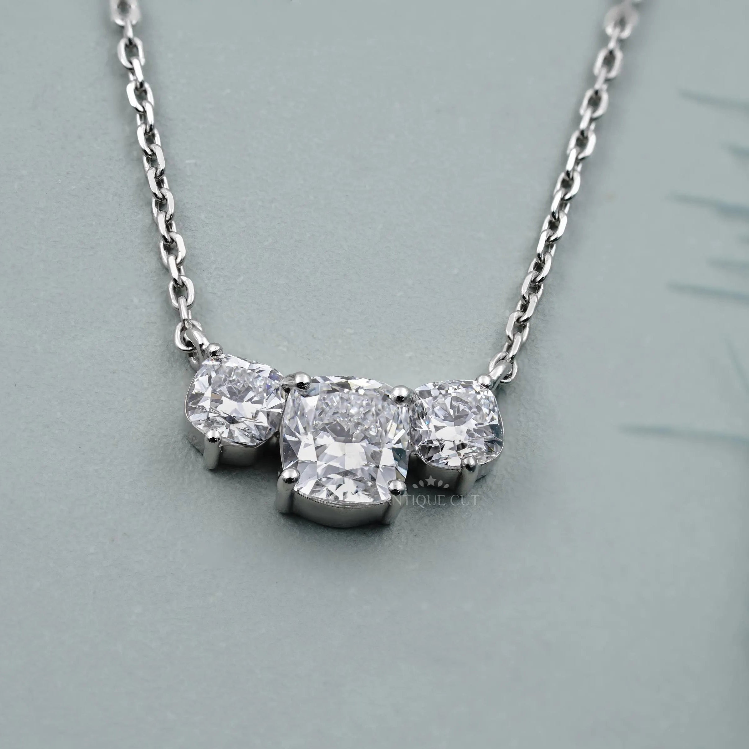 Three stones cushion cut diamond pendant necklace in white gold