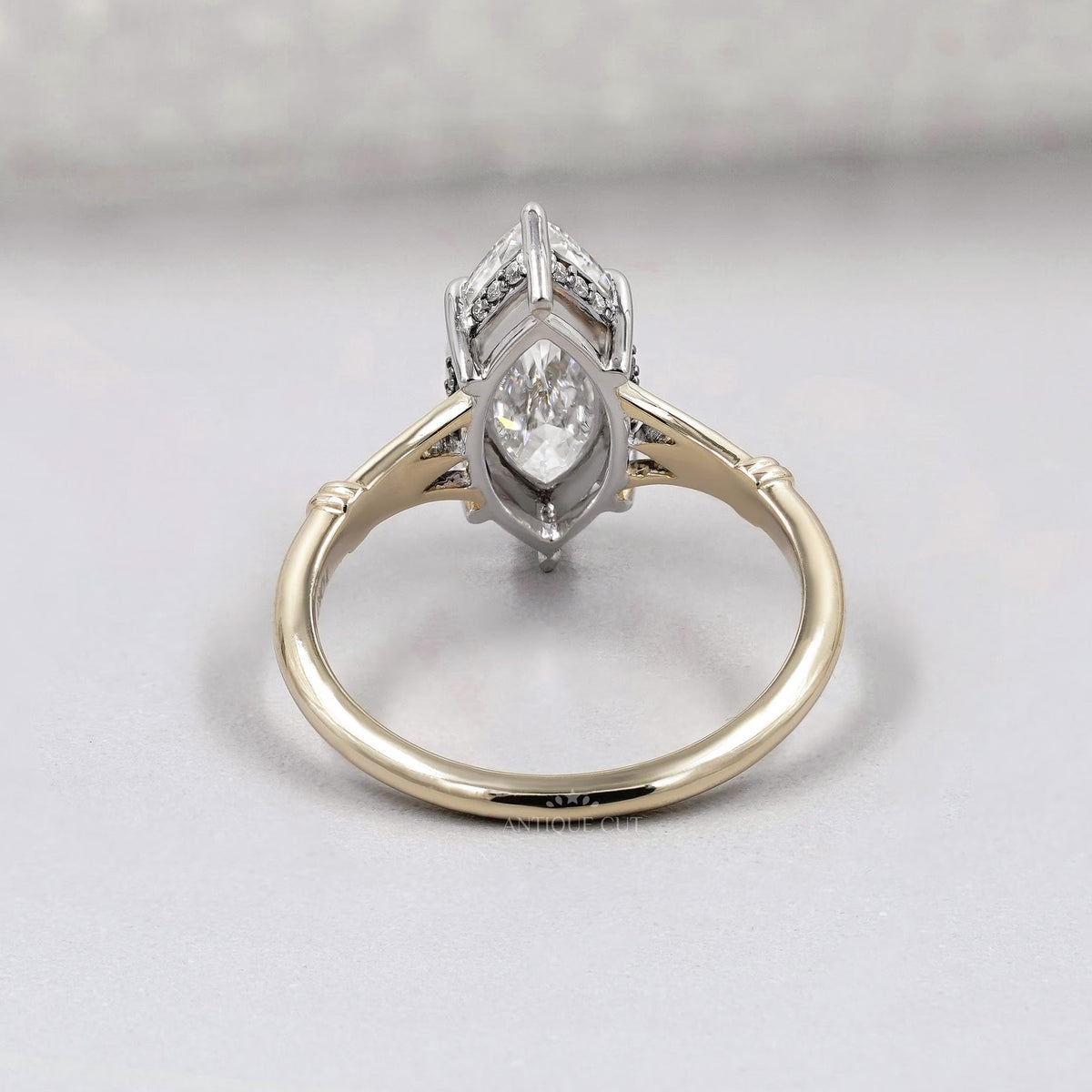 Close up of marquise diamond split shank ring