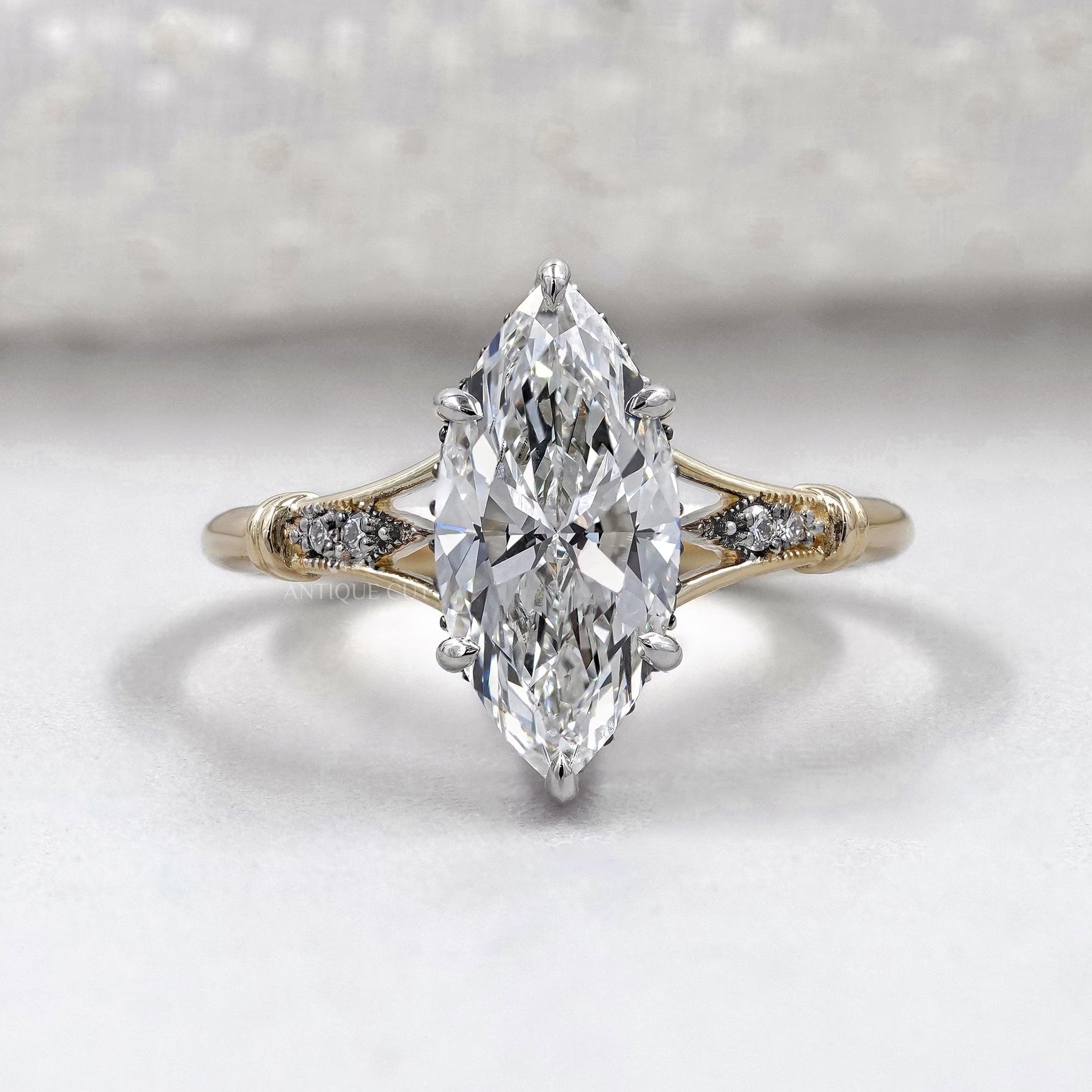 Marquise cut engagement ring with split shank vintage design
