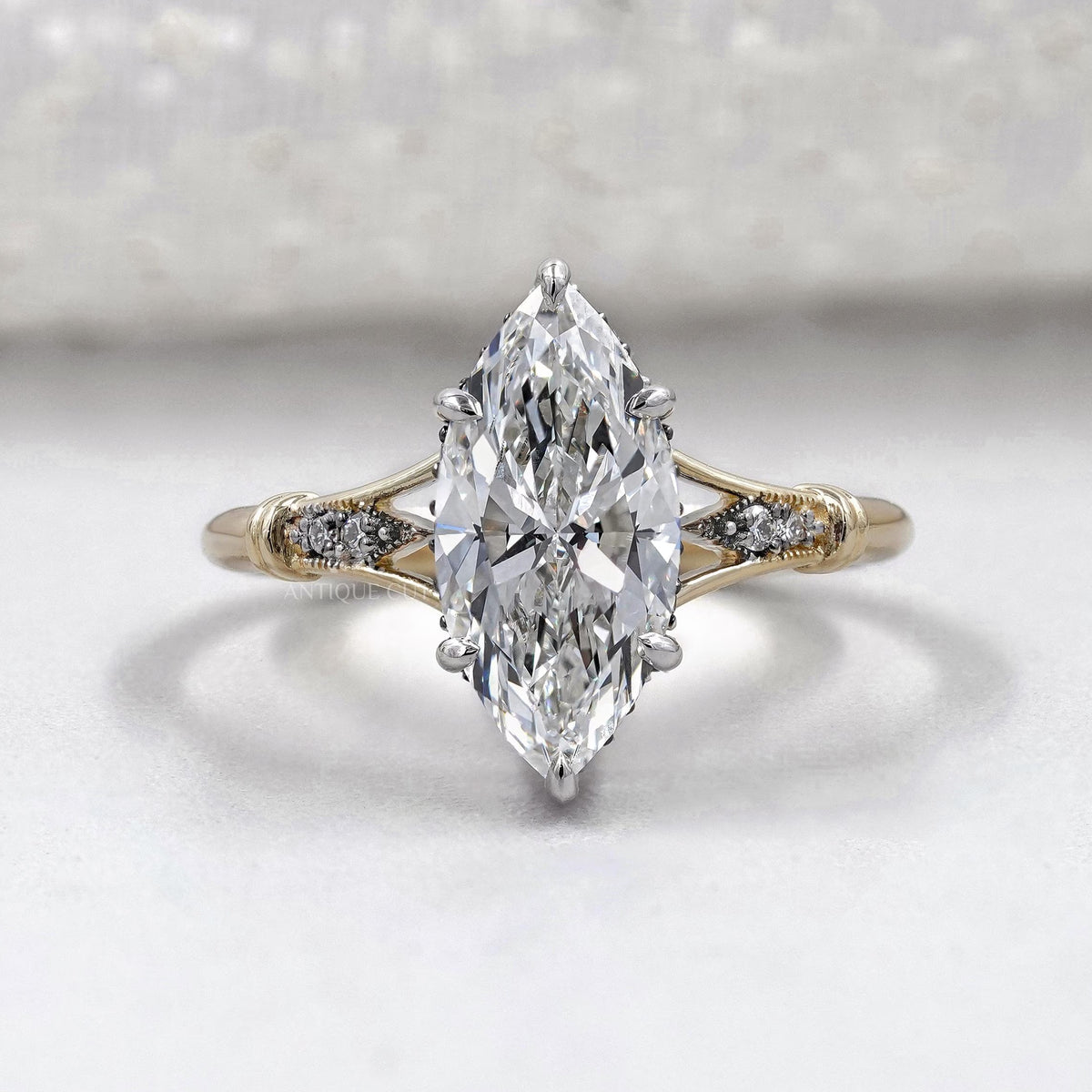 Marquise cut engagement ring with split shank vintage design