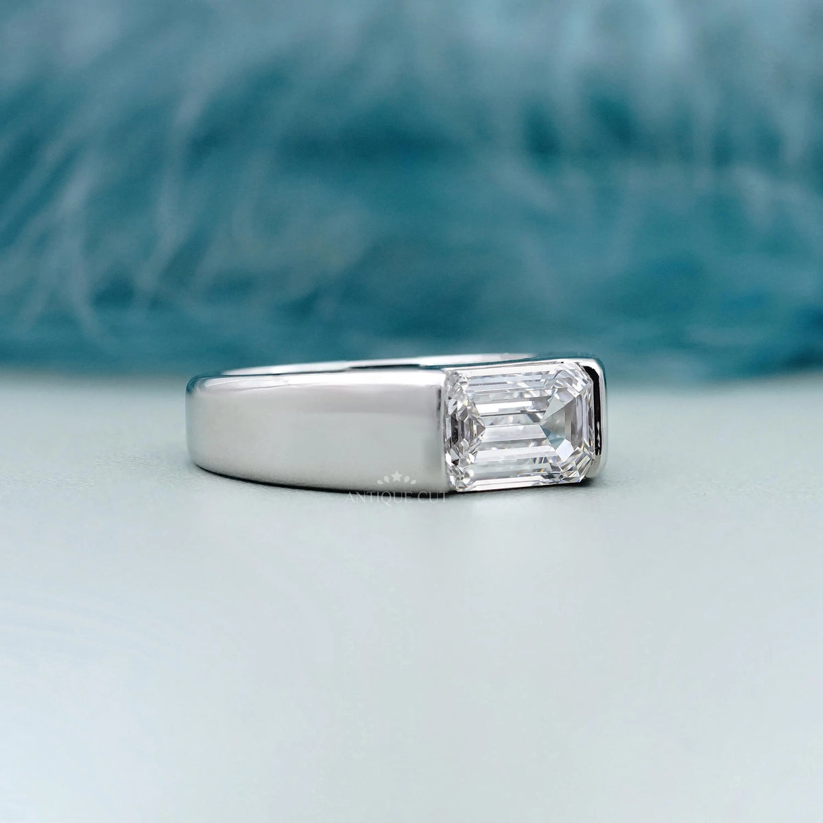 East West emerald cut diamond men's engagement ring in white gold