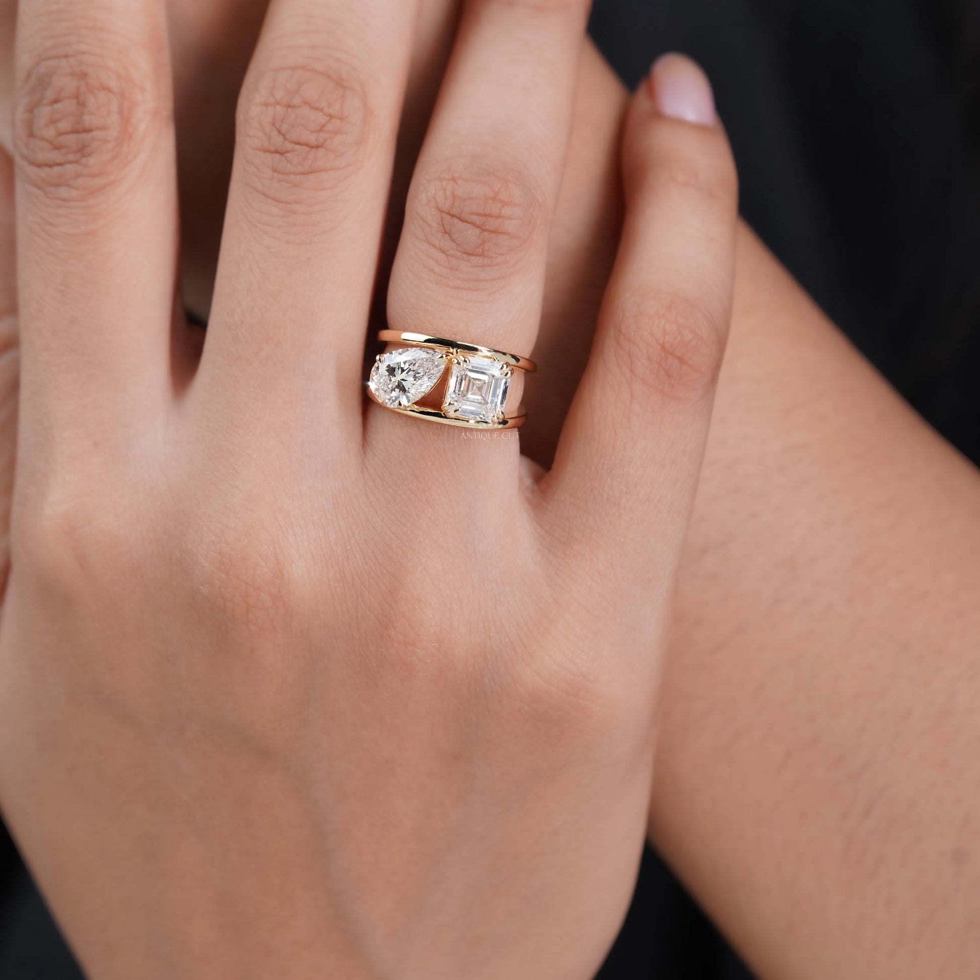 Antiquecut emerald and pear engagement ring in gold