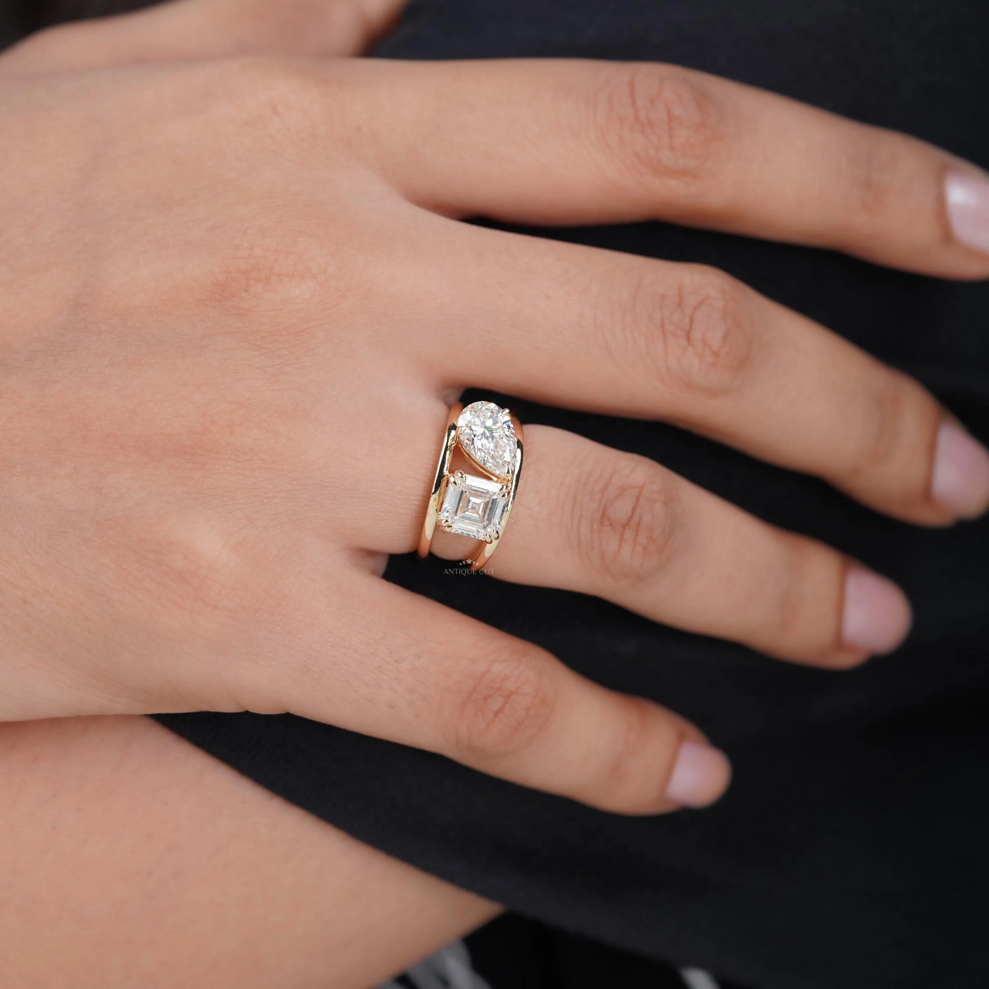 Lab grown emerald and pear diamond ring in yellow gold