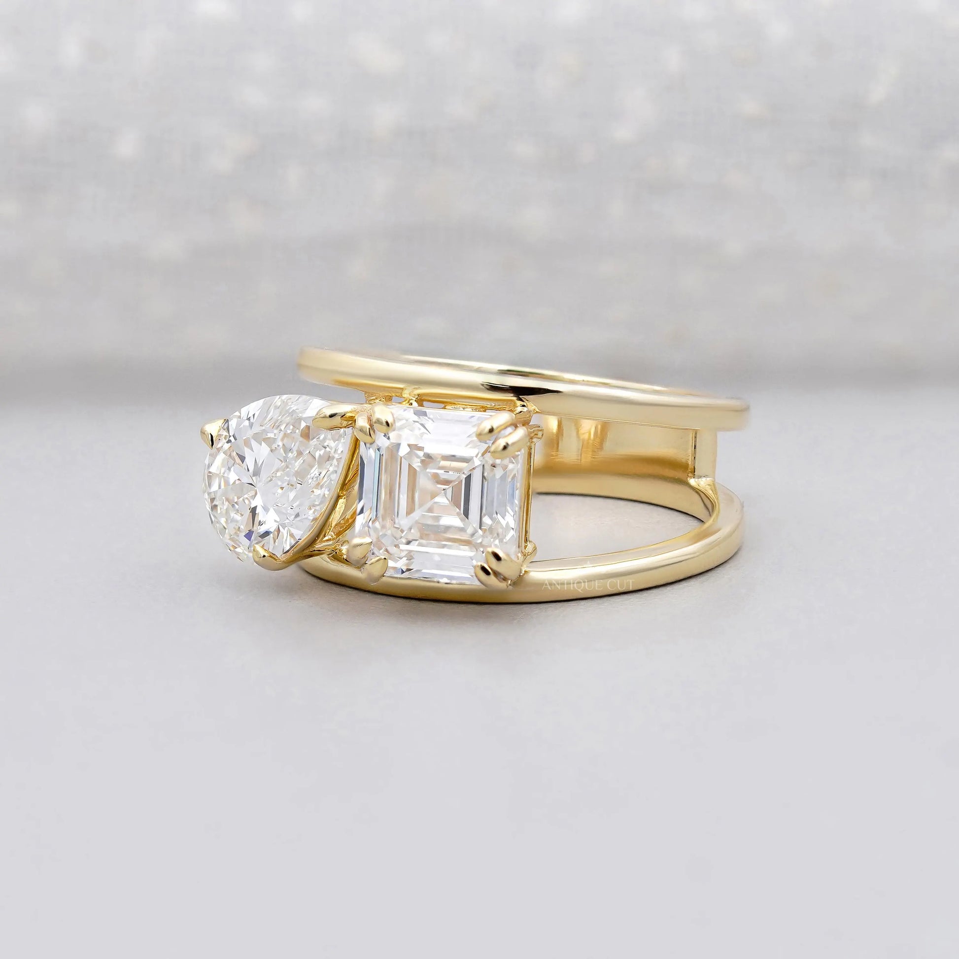 Yellow gold emerald and pear lab grown diamond ring