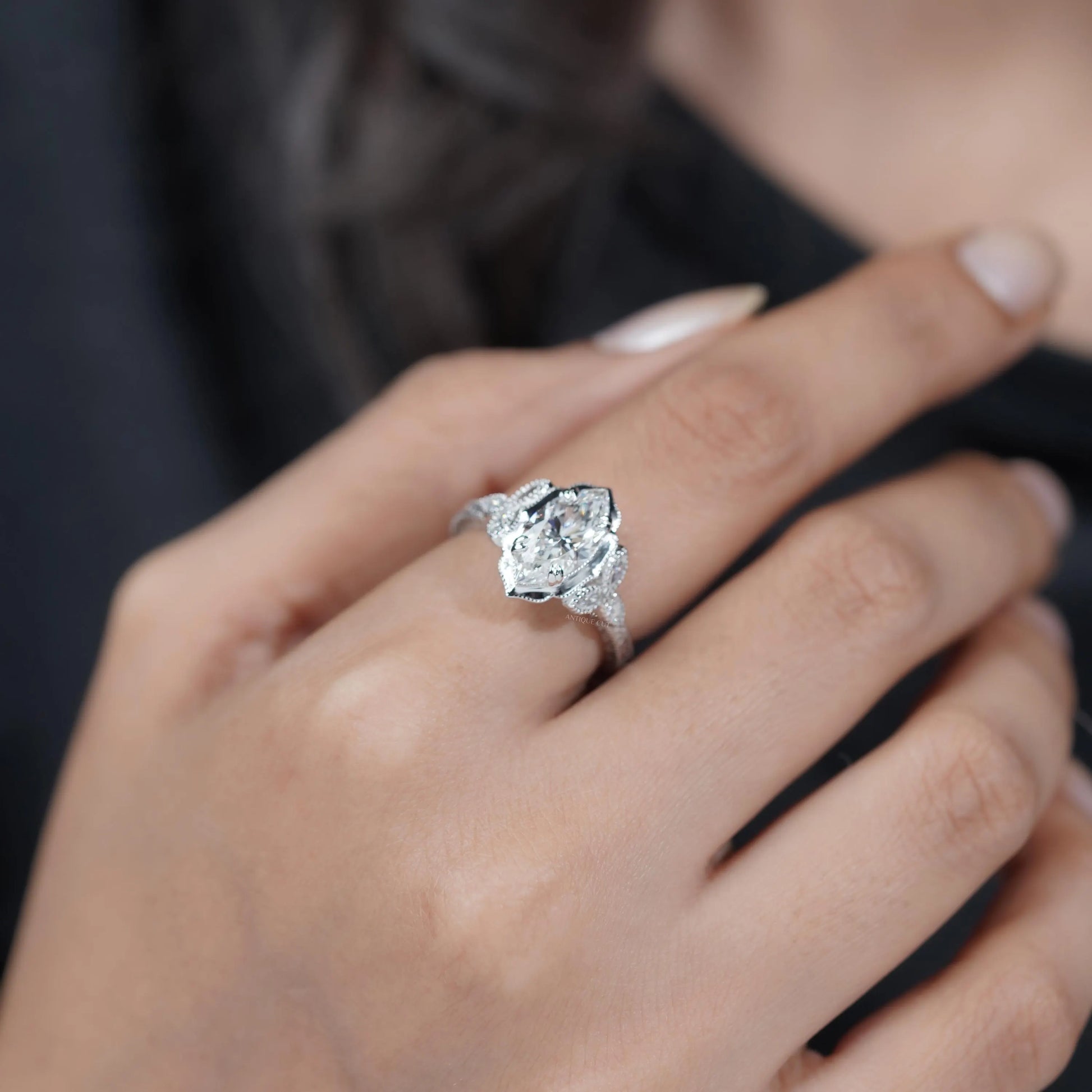 Unique marquise cut engagement ring with accent diamonds