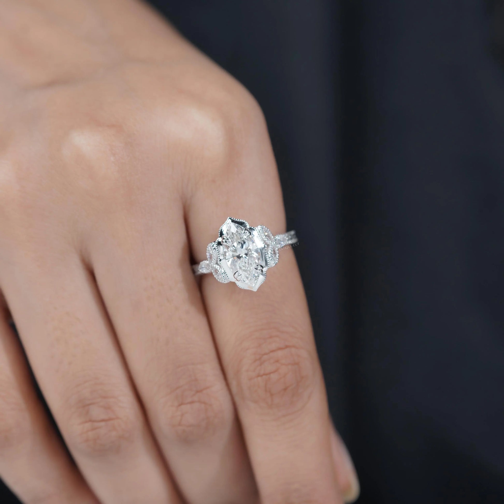 Antique style marquise diamond engagement ring