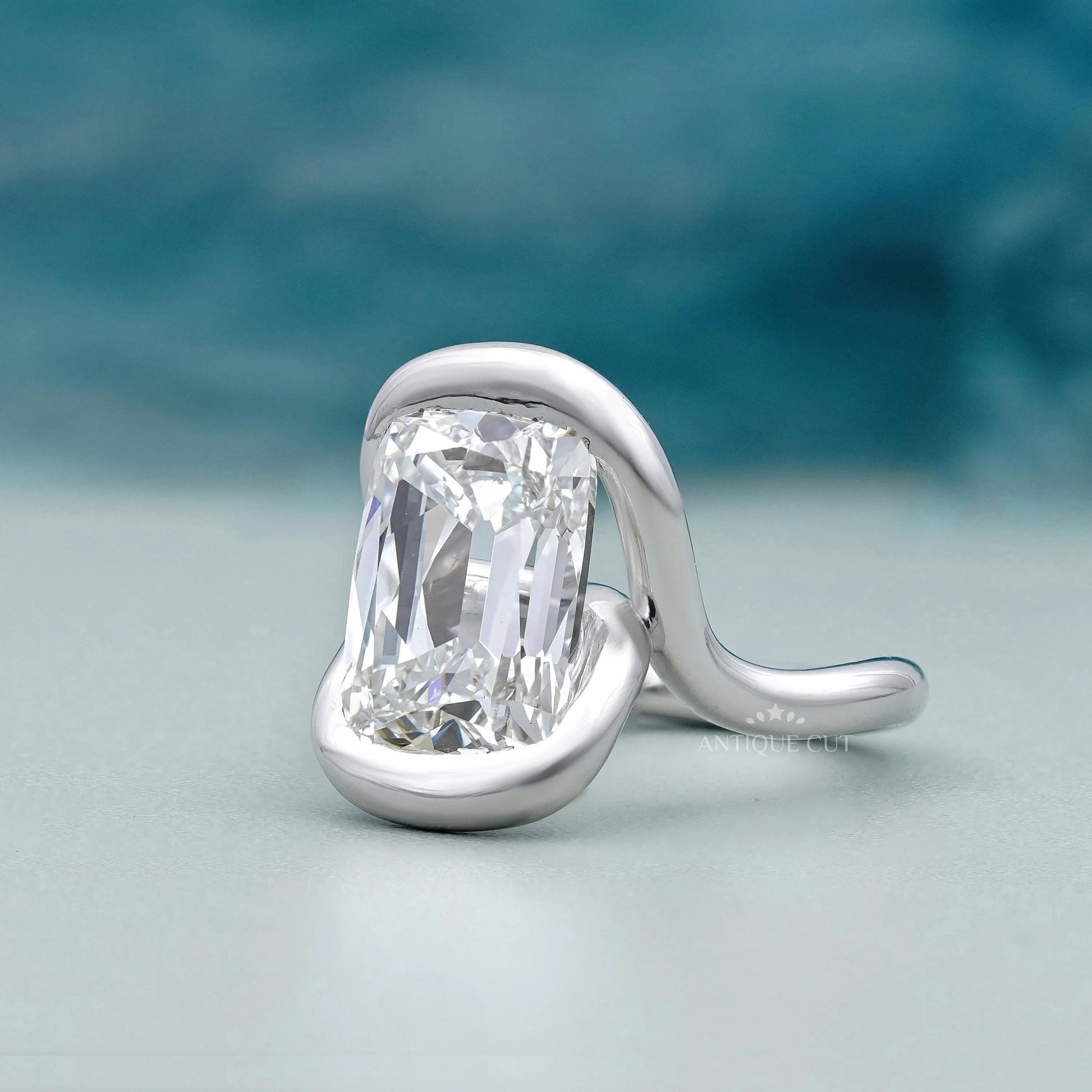 Cushion cut vintage diamond ring with white gold bezel design