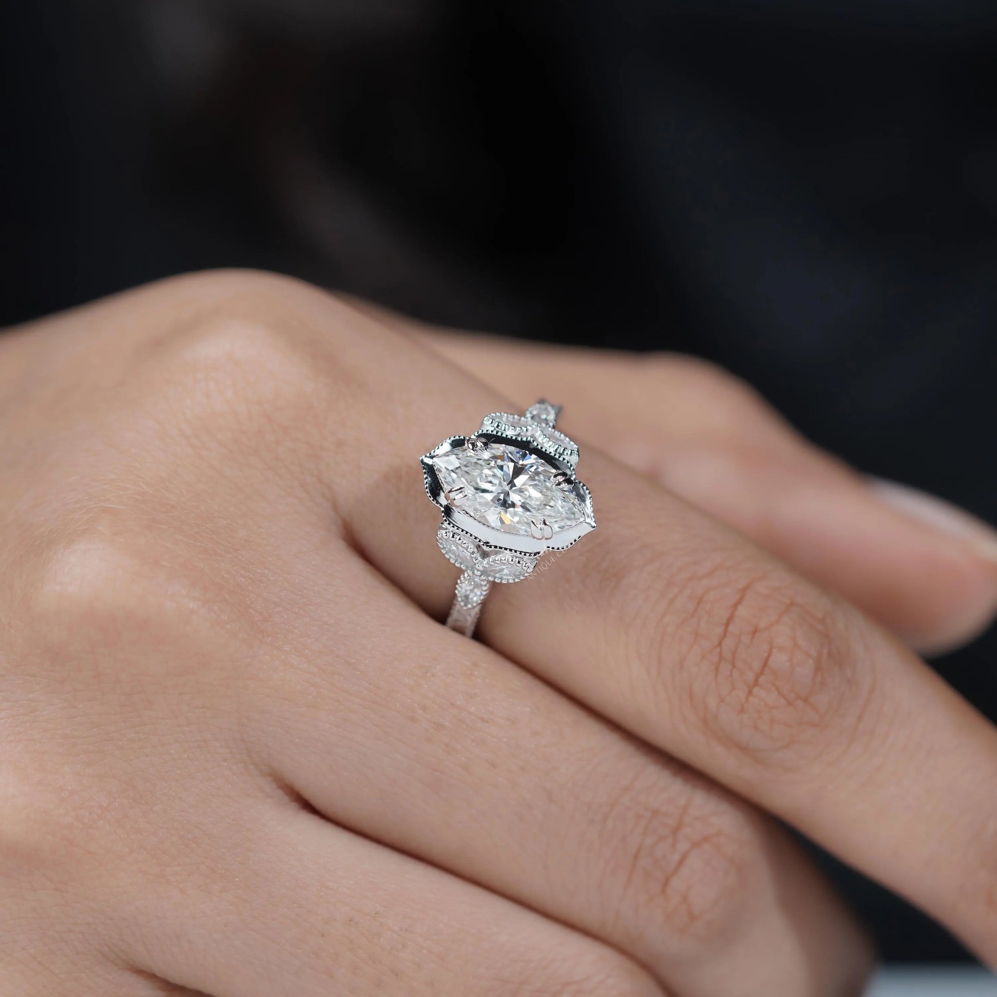 Vintage diamond ring with marquise center stone and side stones