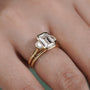Gold ring with a diamond on a finger 
