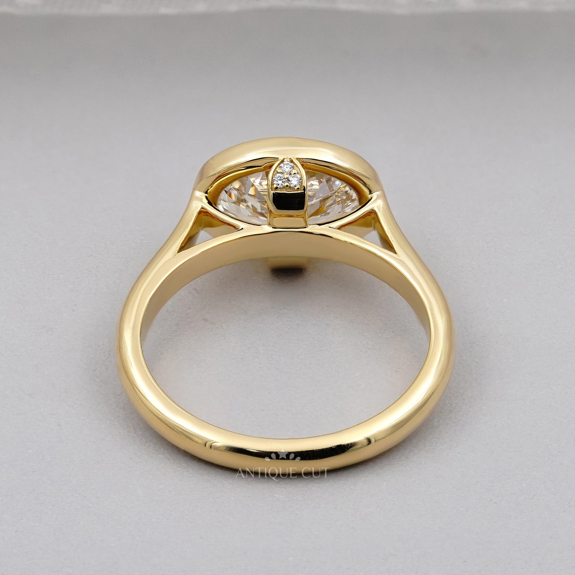 Oval bezel engagement ring side view
