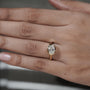 Gold ring with a diamond on a hand