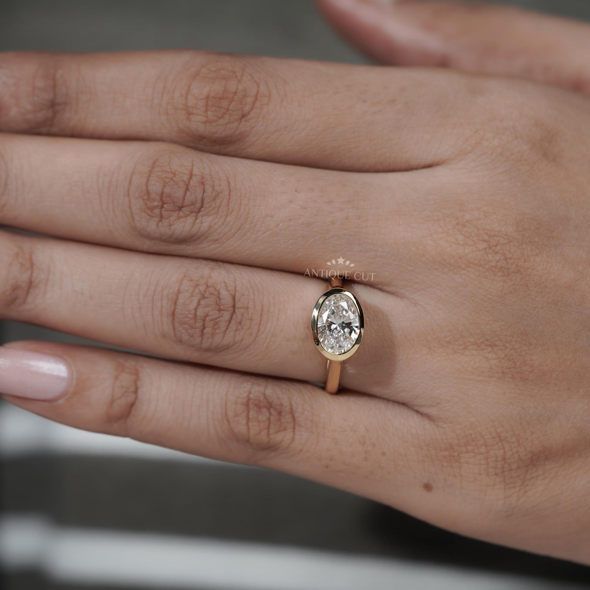 Gold ring with a diamond on a hand