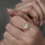 Gold ring with a diamond on a hand