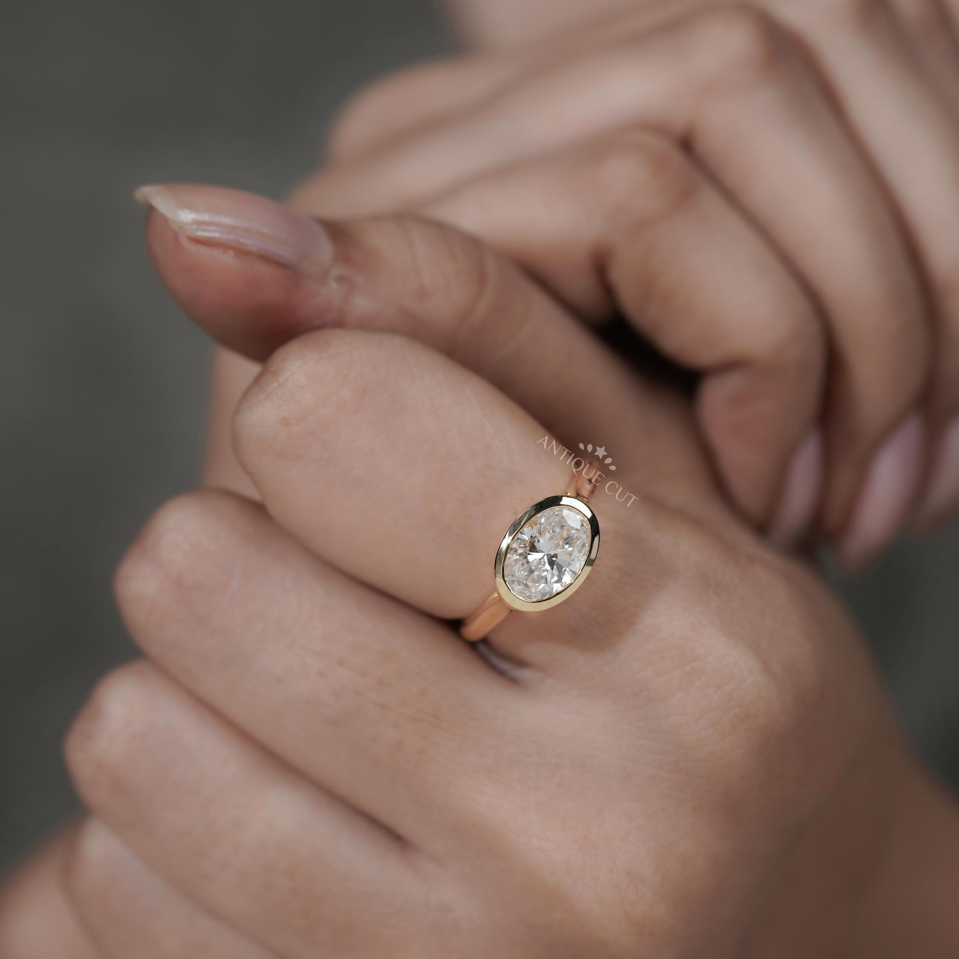 Gold ring with a diamond on a hand