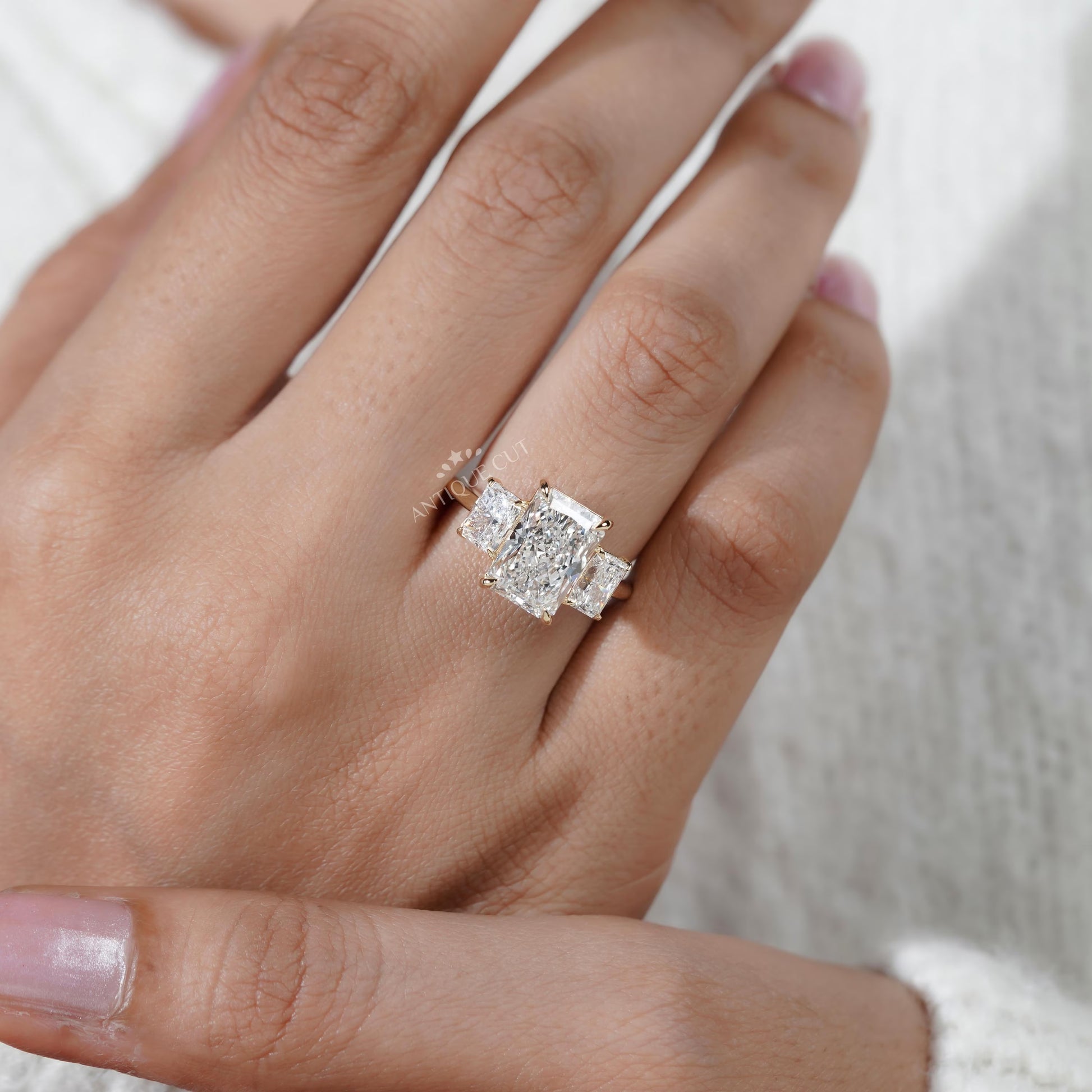 Diamond ring on a hand with a soft background

