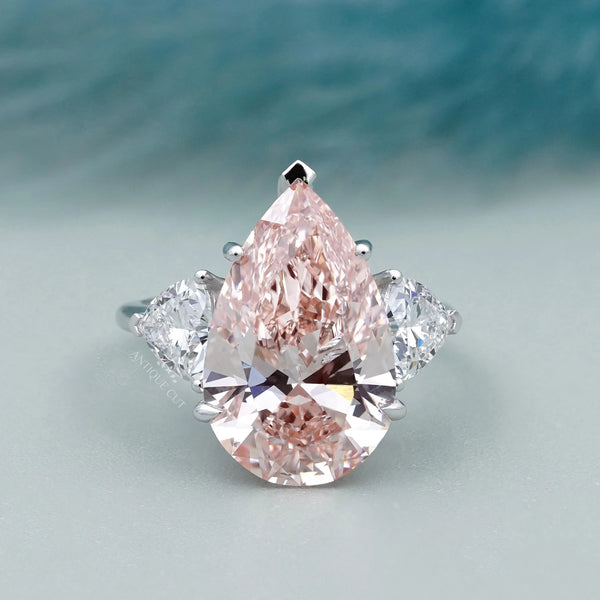Fancy Pink Pear Ring With Trillion Side Stone