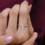 Diamond ring on a finger with a blurred background

