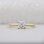Cushion cut diamond ring in yellow gold with hidden accent
