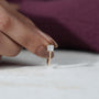 Cushion diamond ring side view with hidden accent
