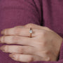 Hand wearing a diamond ring 