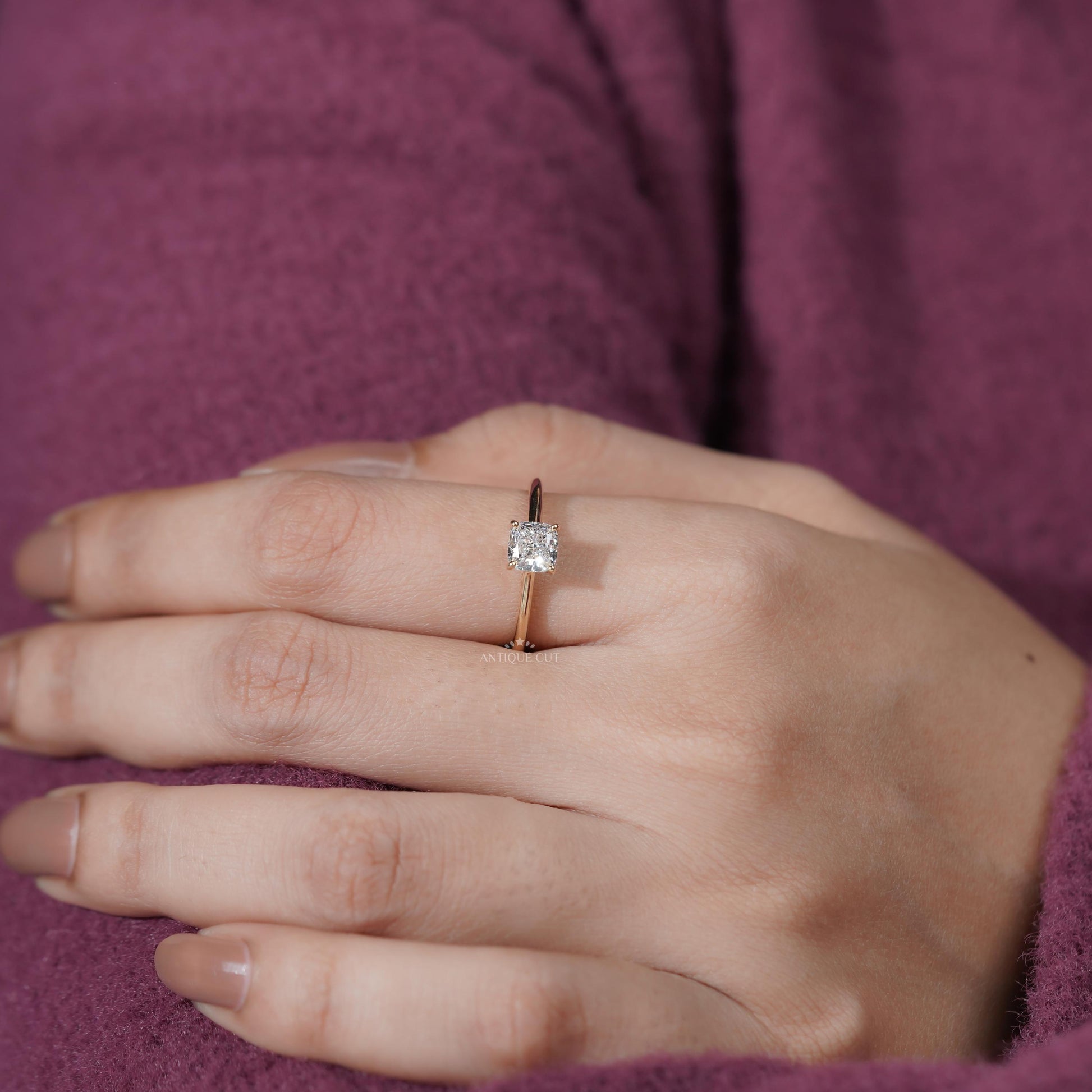 Hand wearing a diamond ring 