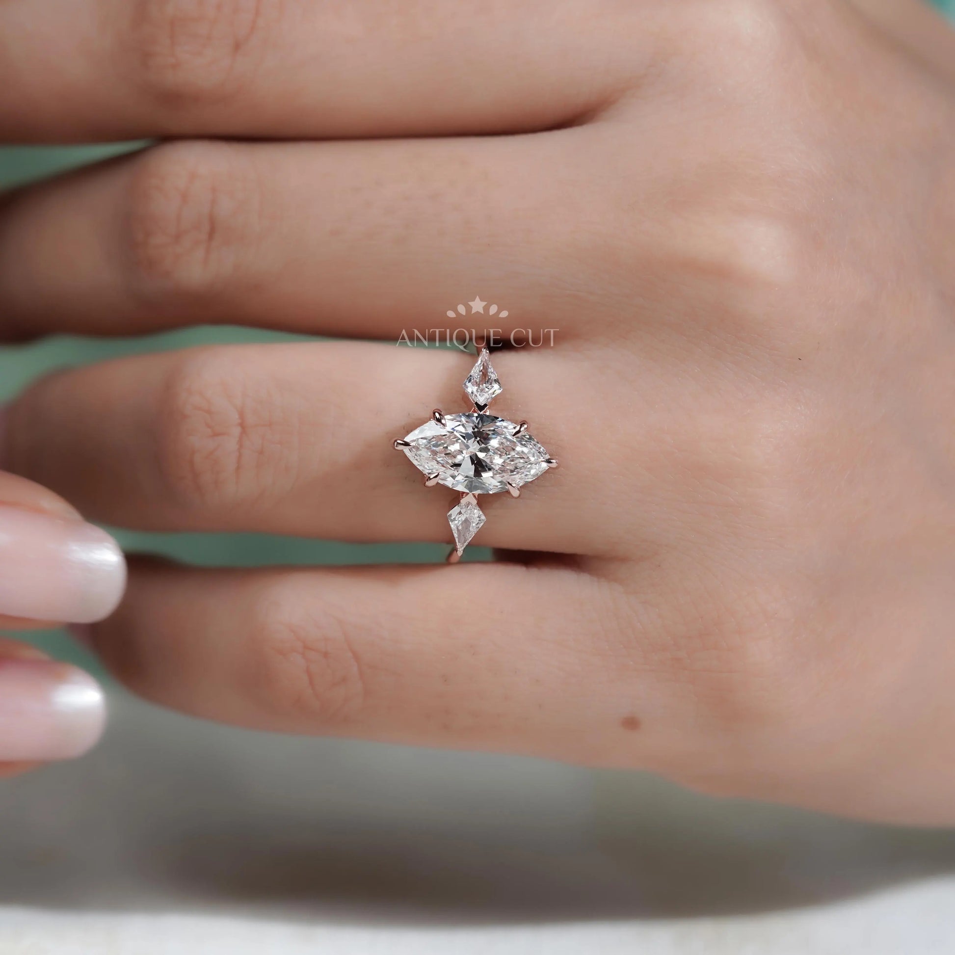 Diamond ring on a finger with a blurred background

